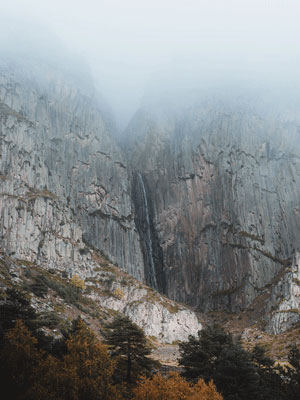 Cliffside waterfall in the mist